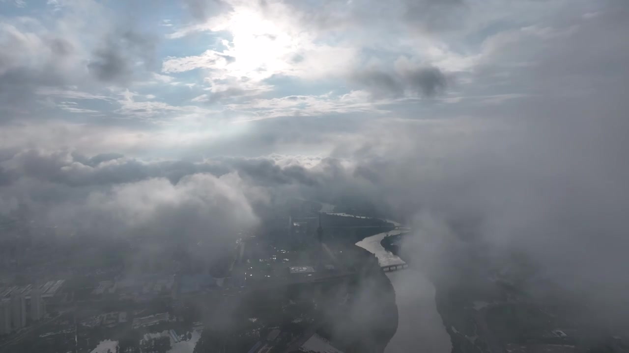 高视角云层之上航拍周口沙颍河流域城市天际线视频素材