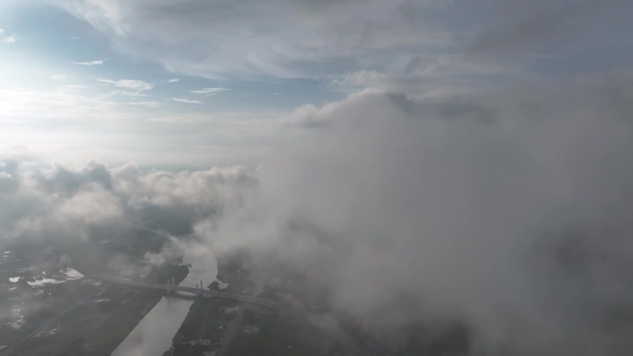 高视角云层之上航拍周口沙颍河流域城市天际线视频素材