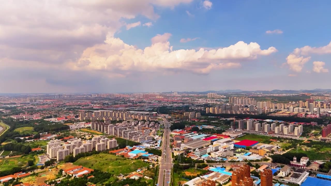 鸟瞰中国青岛市城阳区蓝天白云都市风景视频素材