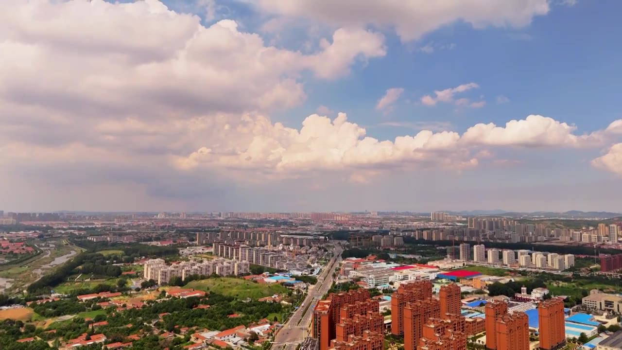 鸟瞰中国青岛市城阳区蓝天白云都市风景视频素材