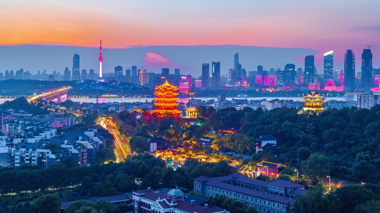 湖北省武汉市黄鹤楼与辛亥革命博物院的城市夕阳晚霞落日夜景延时摄影视频素材