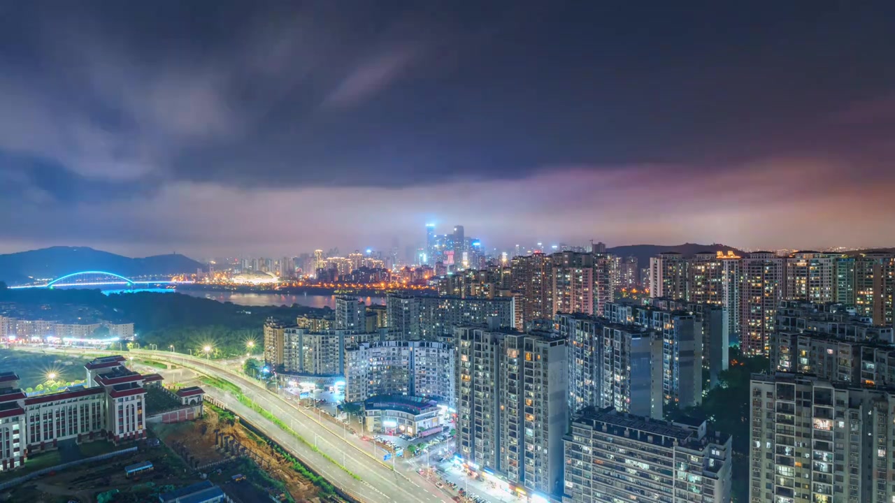 南宁柳沙城市公路繁忙车流与高楼建筑夜景视频素材