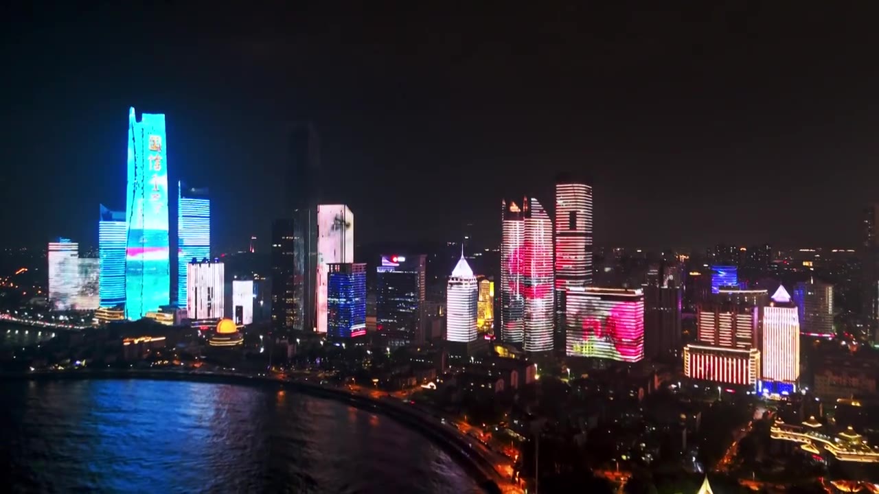 中国山东青岛城市夜景灯光秀航拍海边繁华城市高楼鸟瞰视频素材