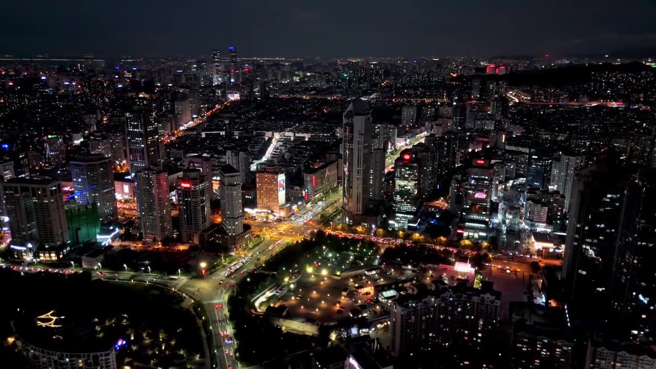 中国山东青岛城市夜景灯光秀航拍繁华城市高楼鸟瞰视频素材