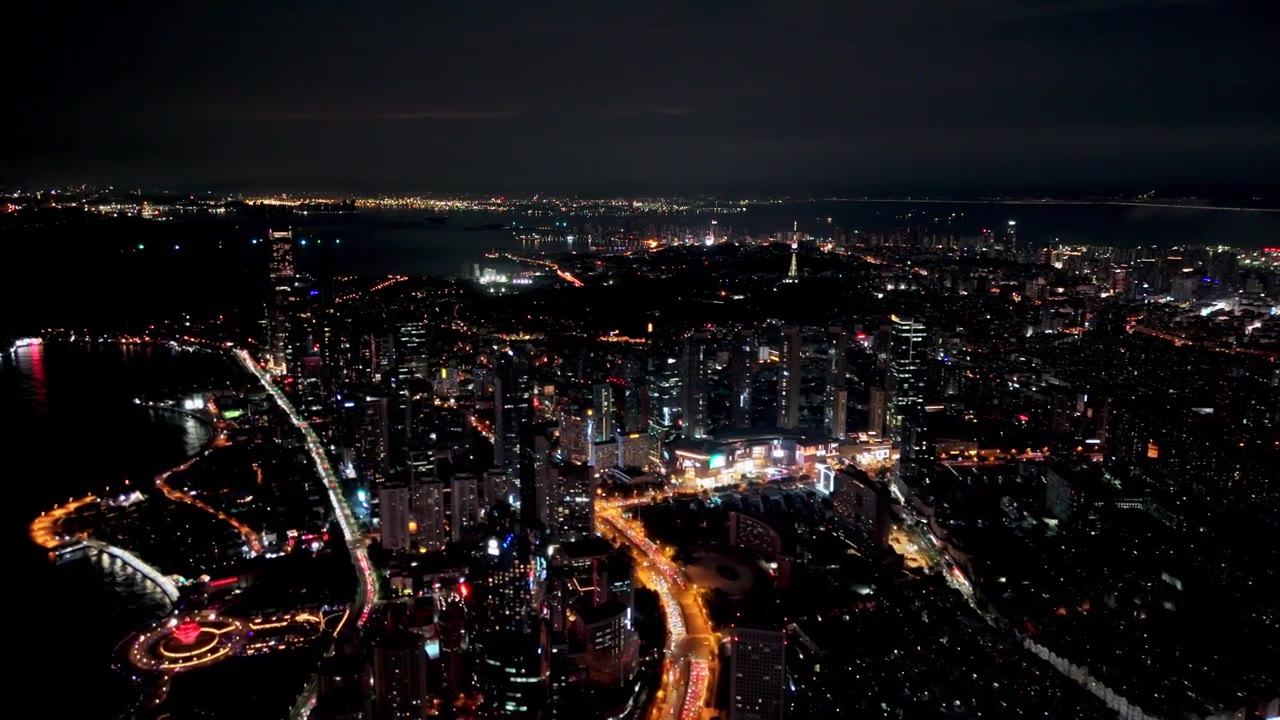 中国山东青岛城市夜景灯光秀航拍繁华城市高楼鸟瞰视频素材