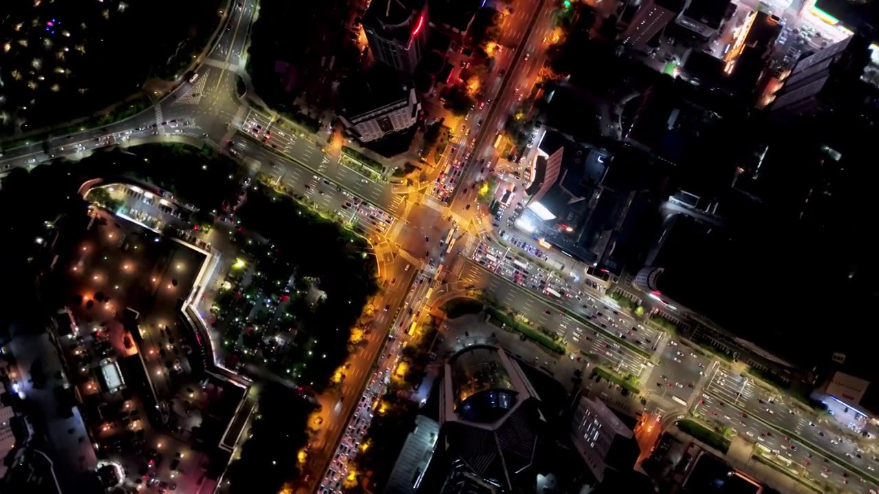 中国山东青岛城市夜景灯光秀航拍繁华城市高楼鸟瞰视频素材