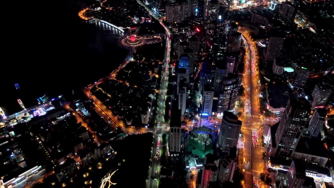 中国山东青岛城市夜景灯光秀航拍繁华城市高楼鸟瞰视频素材