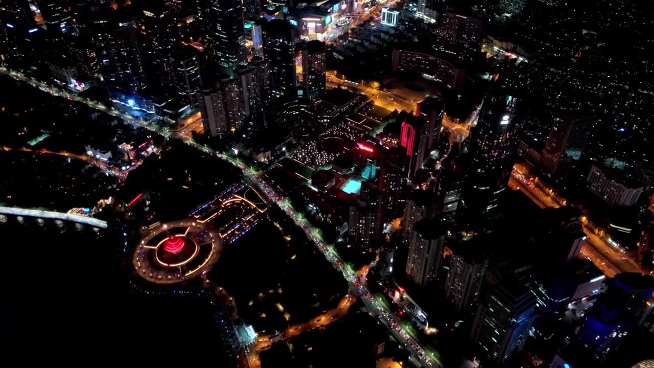 中国山东青岛城市夜景灯光秀航拍繁华城市高楼鸟瞰视频素材