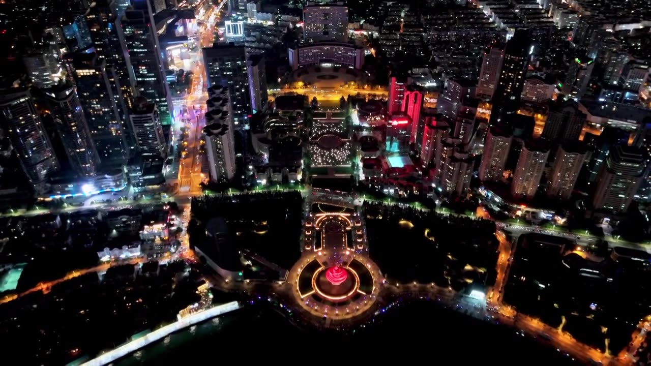 中国山东青岛城市夜景灯光秀航拍繁华城市高楼鸟瞰视频素材