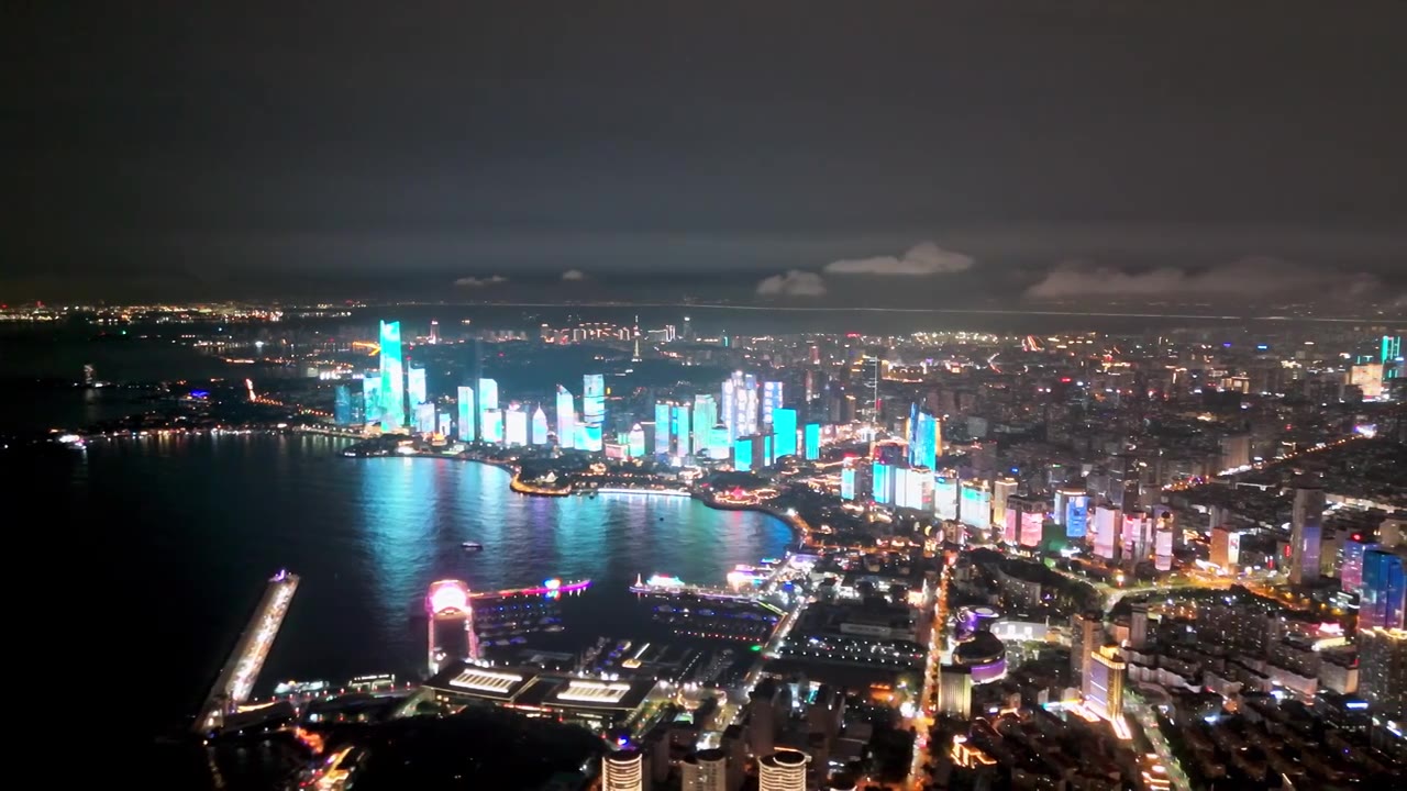 中国山东青岛城市夜景灯光秀航拍繁华城市高楼鸟瞰视频素材