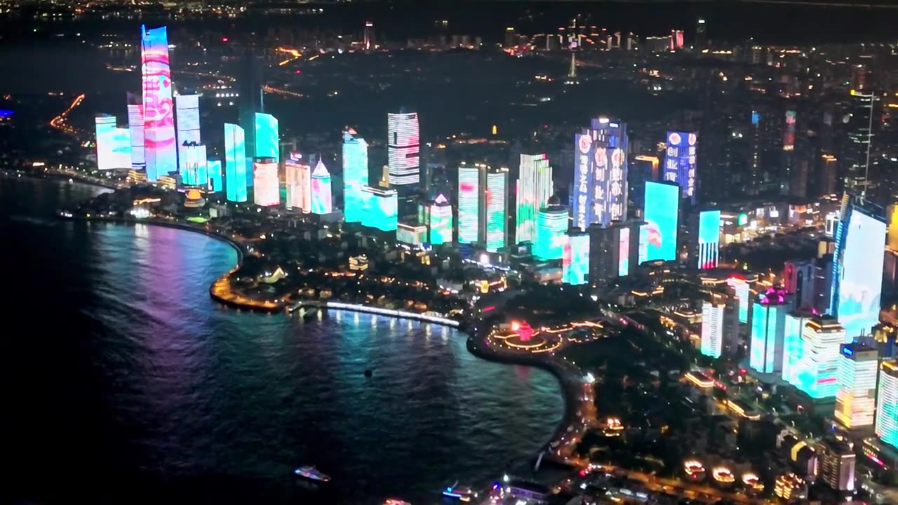 中国山东青岛城市夜景灯光秀航拍繁华城市高楼鸟瞰视频素材