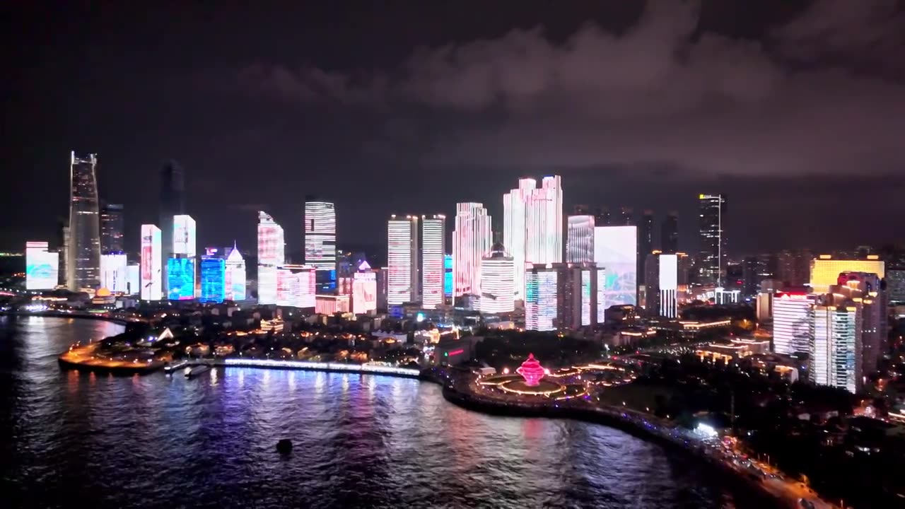 中国山东青岛城市夜景灯光秀航拍繁华城市高楼鸟瞰视频素材