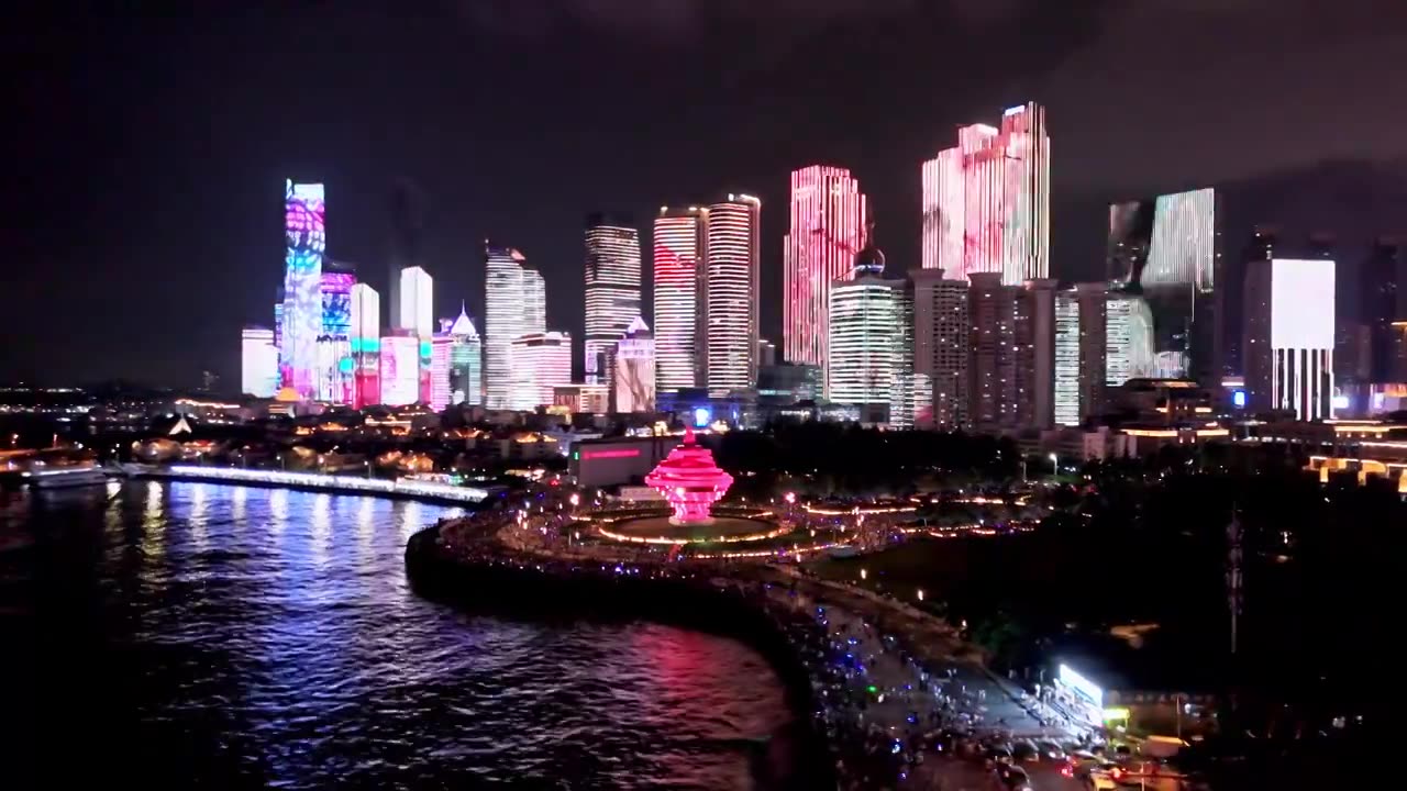 中国山东青岛城市夜景灯光秀航拍繁华城市高楼鸟瞰视频素材