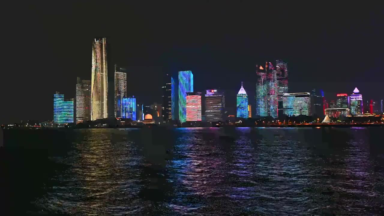 中国山东青岛城市夜景灯光秀航拍繁华城市高楼鸟瞰视频素材