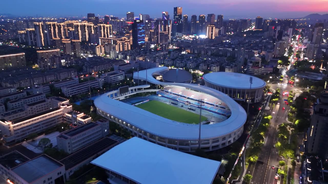 杭州临平体育馆城市晚霞夜景视频下载