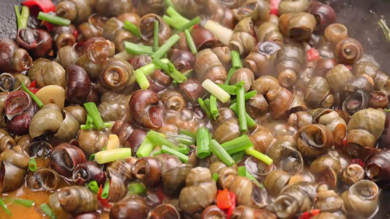 爆炒螺蛳田螺特色美食中餐国菜饮食菜肴视频素材画面3