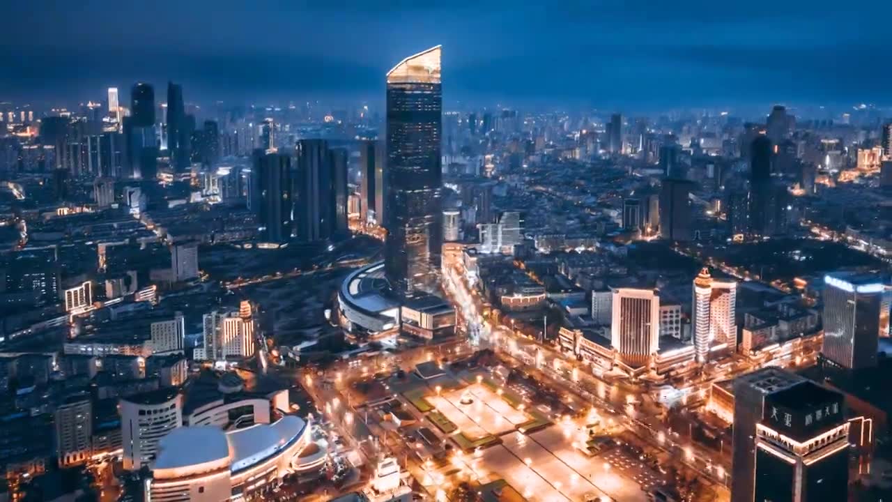 中国辽宁沈阳市府恒隆和人民广场城市天际线夜景航拍环绕延时摄影视频素材画面1