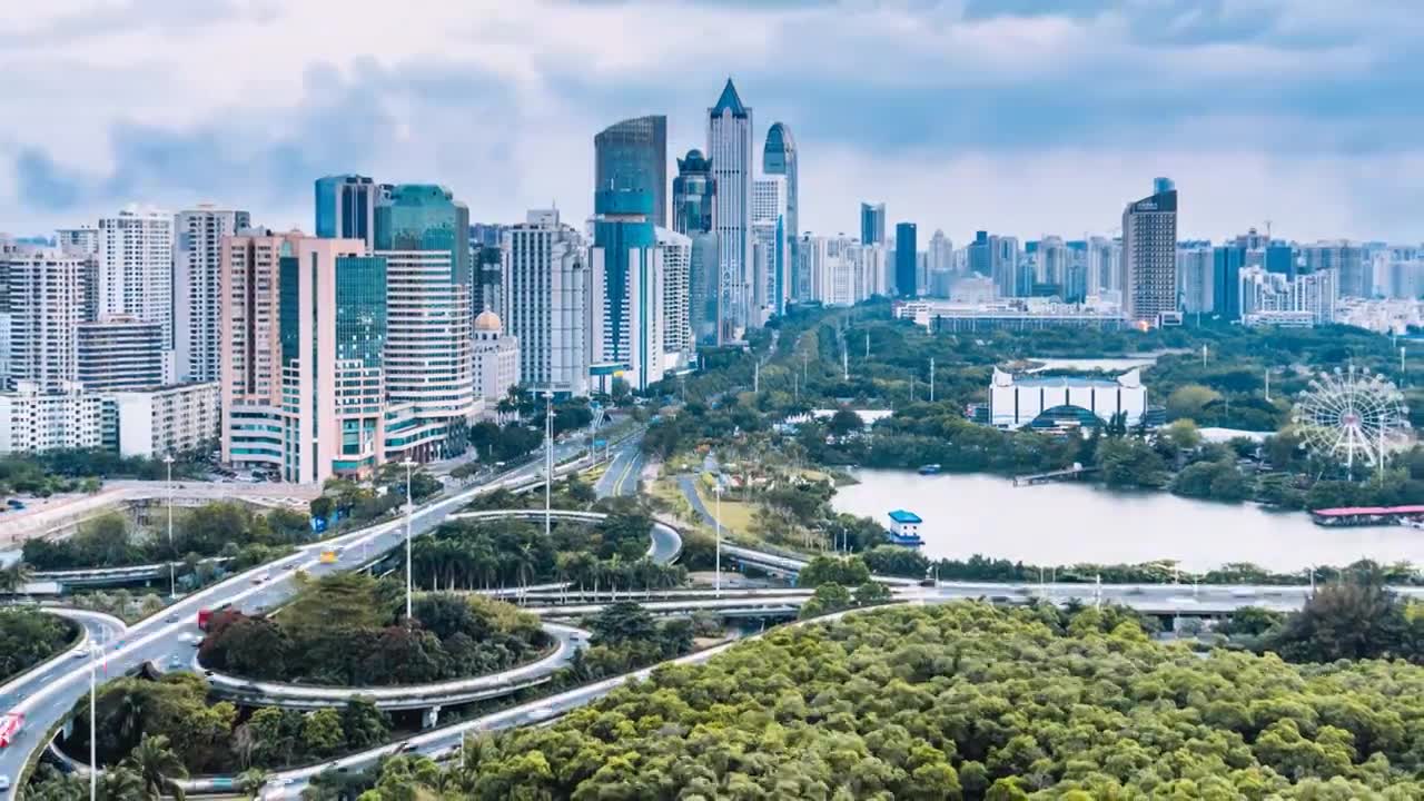 中国海南海口滨海立交桥城市高楼天际线高视角日转夜延时摄影视频素材画面1