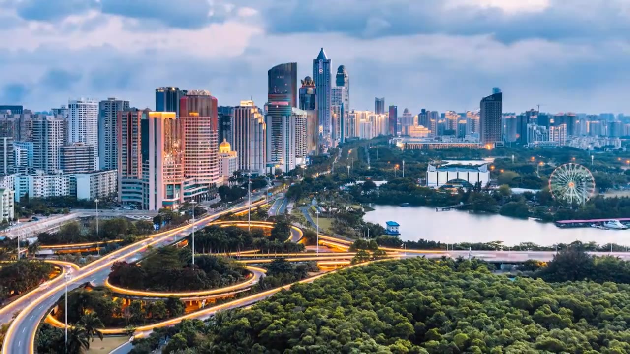 中国海南海口滨海立交桥城市高楼天际线高视角日转夜延时摄影视频素材画面3