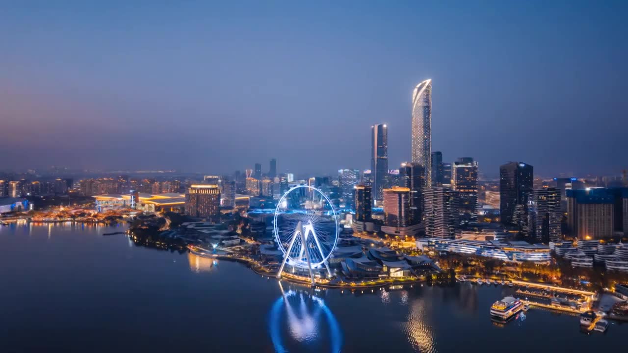 中国江苏苏州金鸡湖摩天轮城市天际线夜景航拍环绕延时摄影视频素材画面1