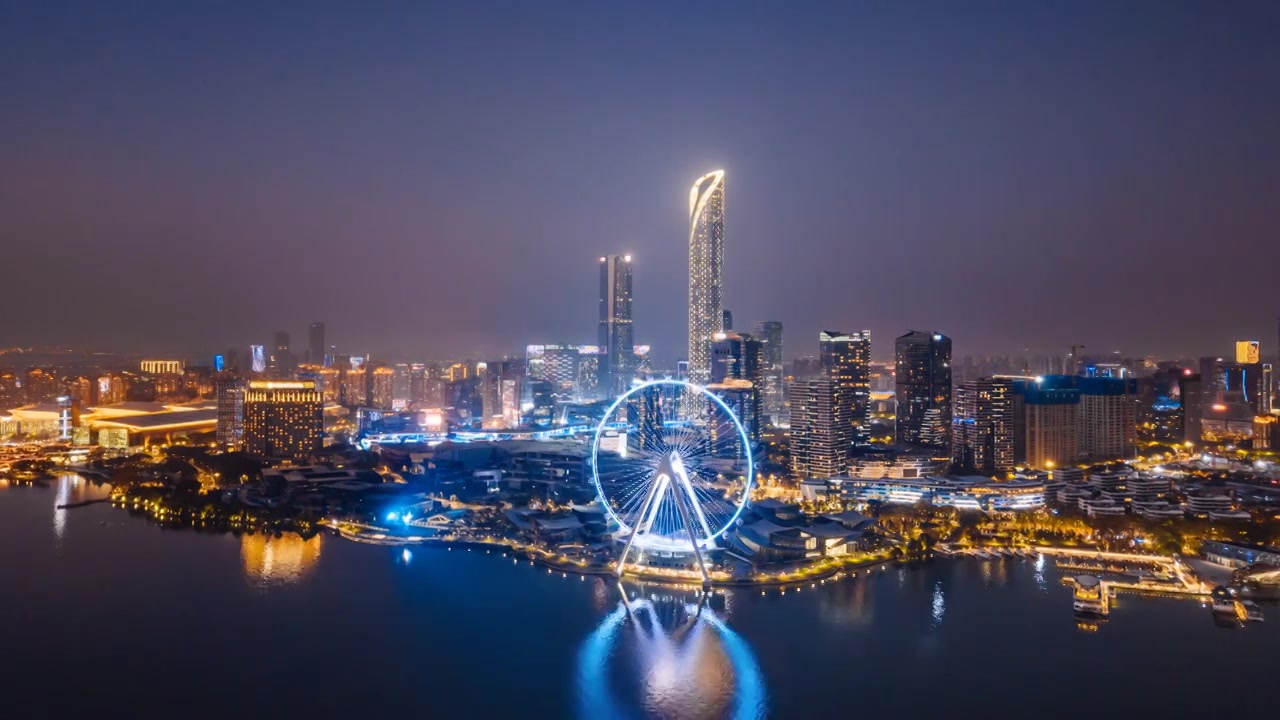 中国江苏苏州金鸡湖摩天轮城市天际线夜景航拍环绕延时摄影视频素材画面3