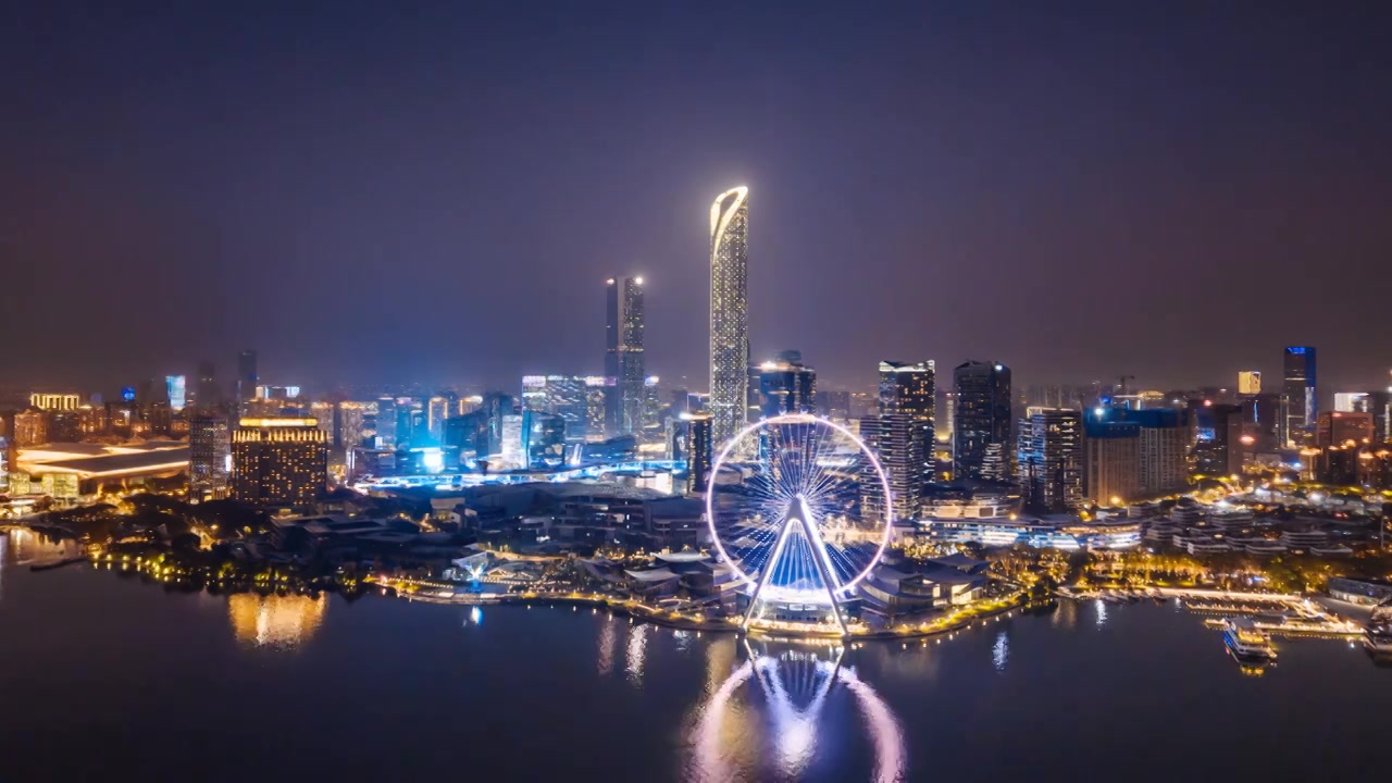 中国江苏苏州金鸡湖摩天轮城市天际线夜景航拍环绕延时摄影视频素材画面4