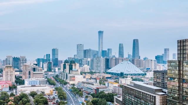 中国北京CBD建筑群和城市车流日转夜延时摄影视频素材