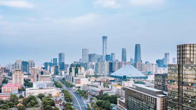 中国北京CBD建筑群和城市车流日转夜延时摄影视频素材