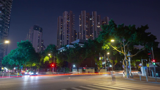 夜间时间广州城市公寓综合体交通街道十字路口时间推移全景4k中国视频素材