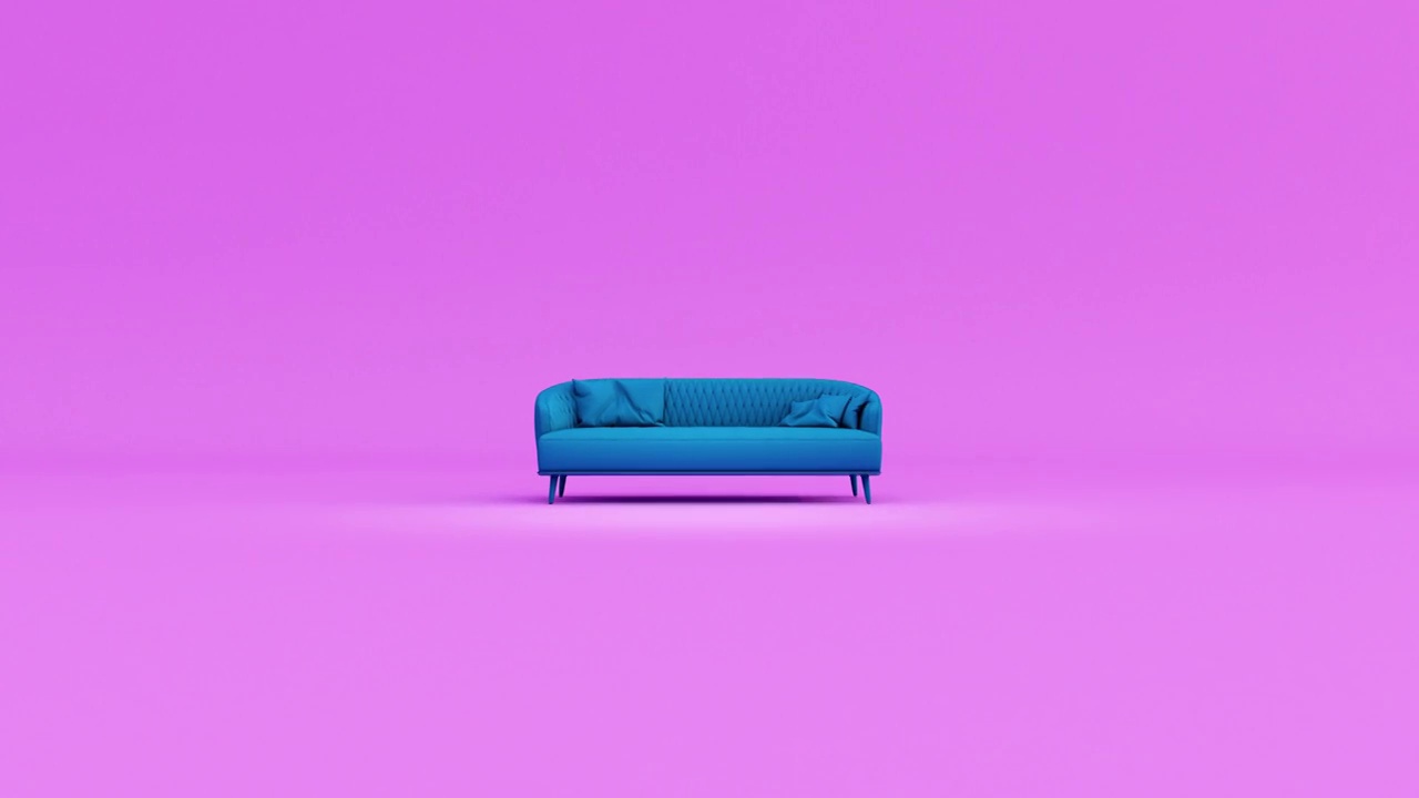 蓝色织物沙发与枕头隔离在粉红色的背景。视频素材画面2