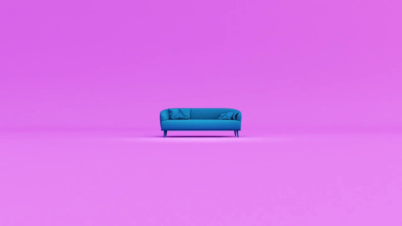 蓝色织物沙发与枕头隔离在粉红色的背景。视频素材画面3