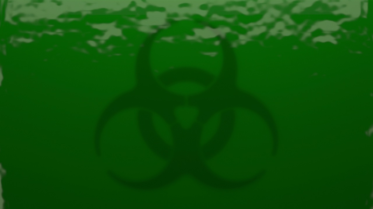 绿色毒药滴在生物危害标志上视频素材画面3