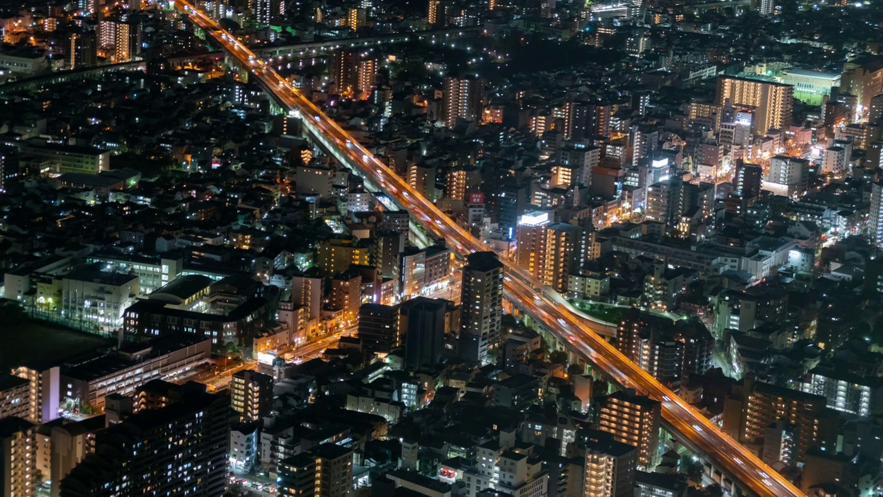 夜间大阪城市景观的时间间隔鸟瞰图视频素材