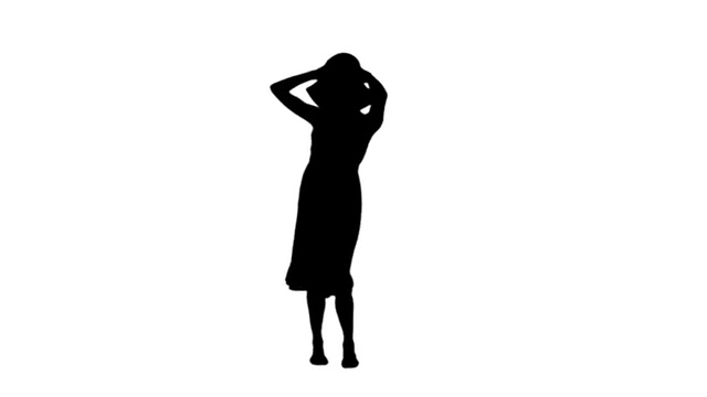 女人戴着太阳帽和太阳裙在黑色剪影视频素材画面1