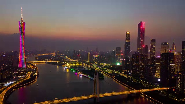 中国日落时间夜晚照明广州市中心城市景观珠江烈德桥空中全景4k时间视频素材