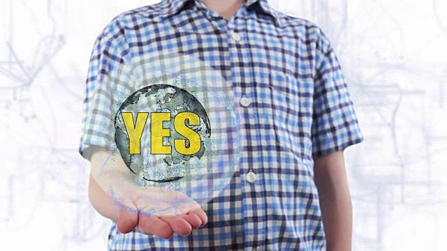 年轻人展示了地球的全息图，并写道:是的视频素材画面2
