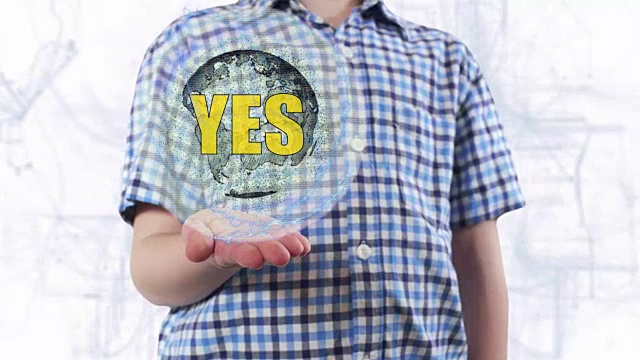 年轻人展示了地球的全息图，并写道:是的视频素材画面4
